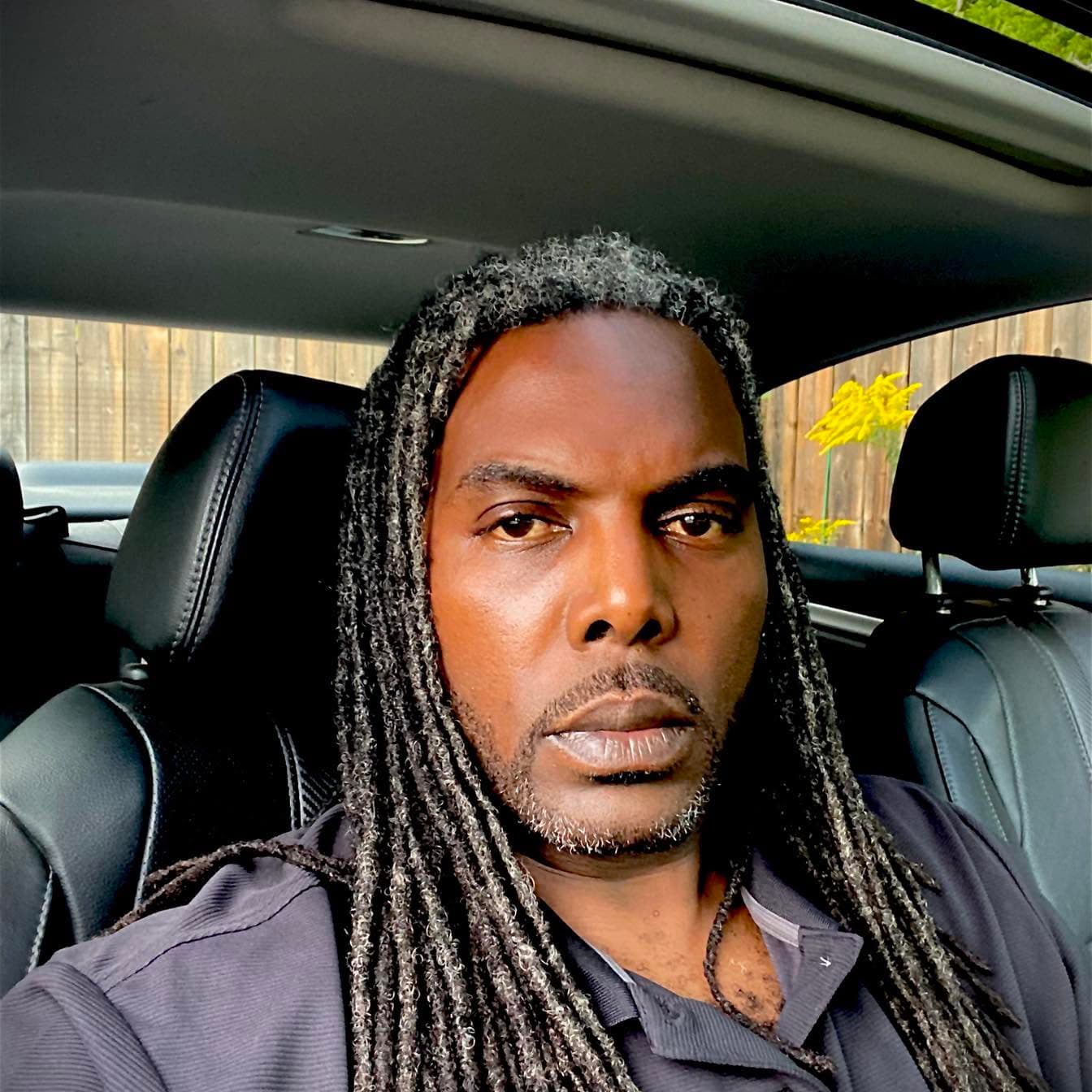 The creator of RYMODE, sitting in a car